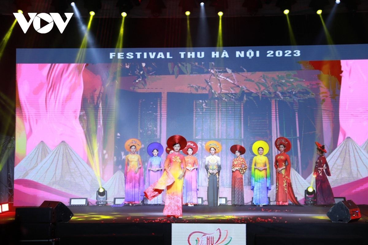 Models perform in an Ao Dai (traditional long dress) fashion show during the opening ceremony.