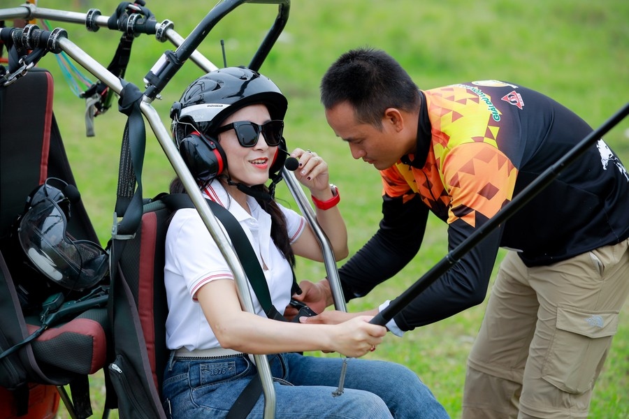 Passengers have their seat belts carefully fastened and thoroughly checked by technical pilots before taking off.