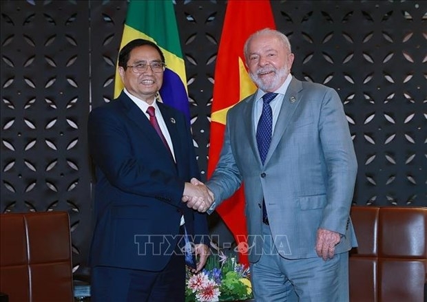 Prime Minister Pham Minh Chinh (L) has a meeting with Brazilian President Luiz Inácio Lula da Silva on May 21, when the Vietnamese leader attends the expanded G7 Summit in Hiroshima. (Photo: VNA)