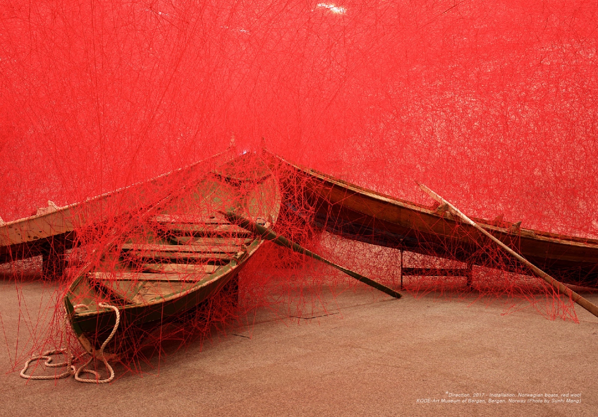 A wooden boat is set up at the exhibition