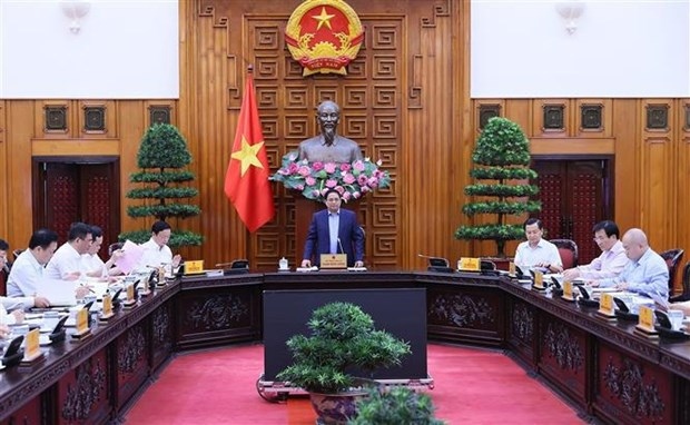 PM Pham Minh Chinh (standing) chairs the meeting on power supply on October 28. (Photo: VNA)
