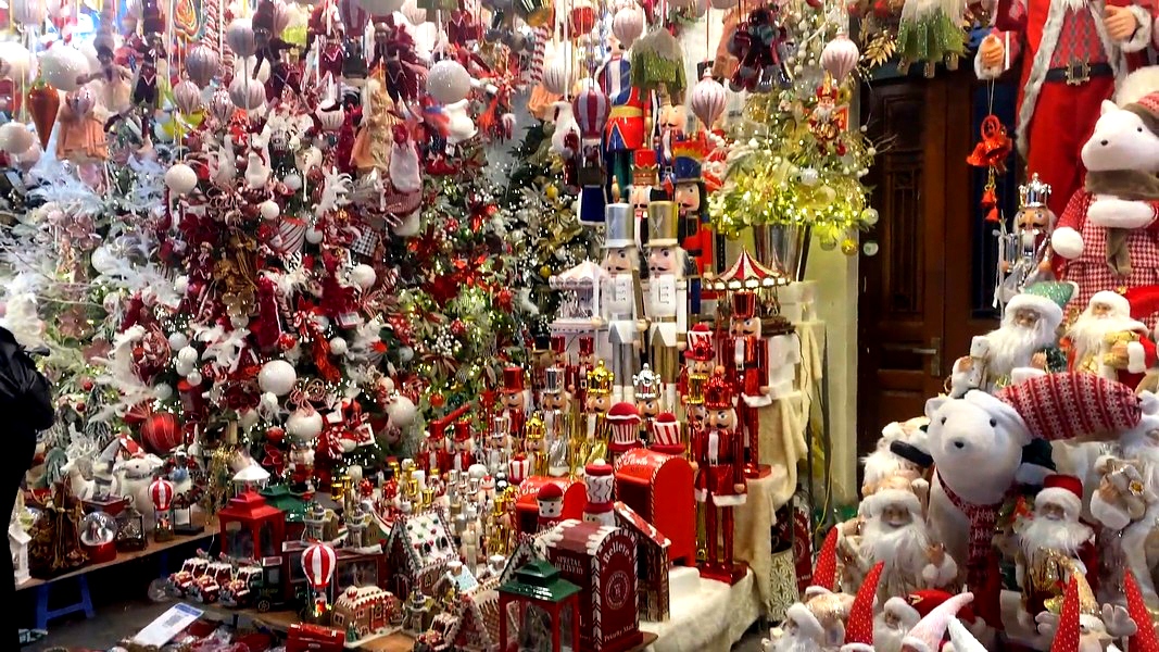 Colourful items are hung outside each store to attract buyers.