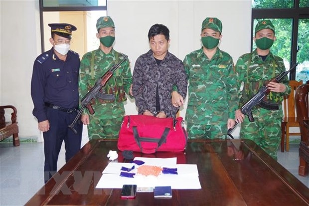 The arrested drug trafficker at the investigation agency (Photo: VNA)