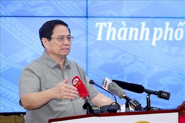 Prime Minister Pham Minh Chinh speaks at the meeting. (Photo: VNA) 