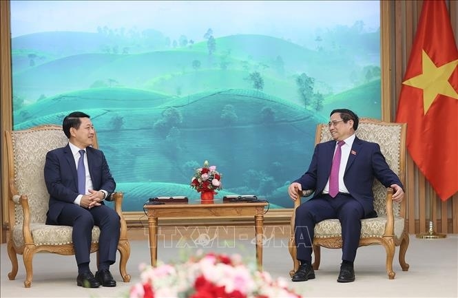  Prime Minister Pham Minh Chinh (R) and Lao Deputy Prime Minister and Foreign Minister Saleumxay Kommasith (Photo:VNA)