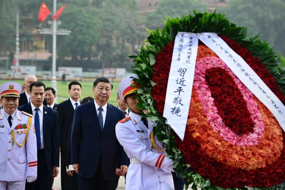 ‘President Ho Chi Minh, leader of the Vietnamese people, will live long forever’, reads that wreath.