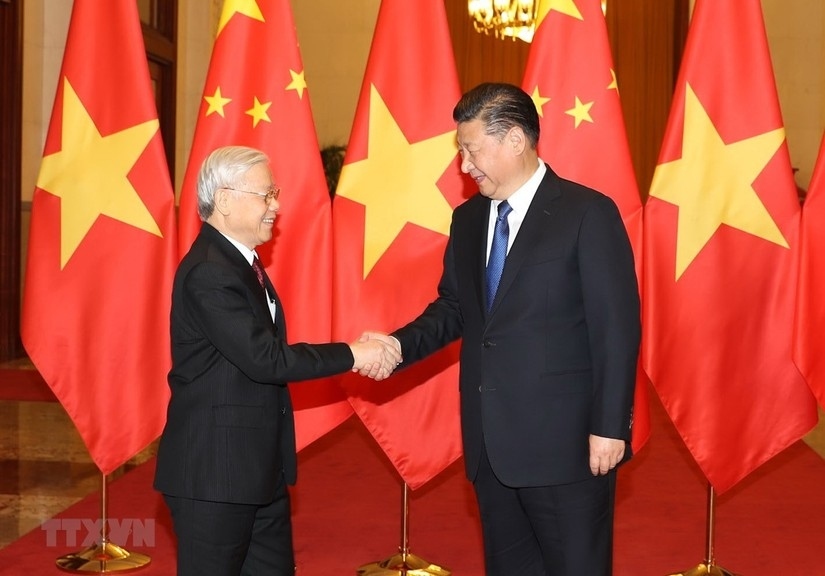 Vietnamese Party General Secretary Nguyen Phu Trong and Chinese Party General Secretary and President Xi Jinping during a meeting. (Photo: VNA)