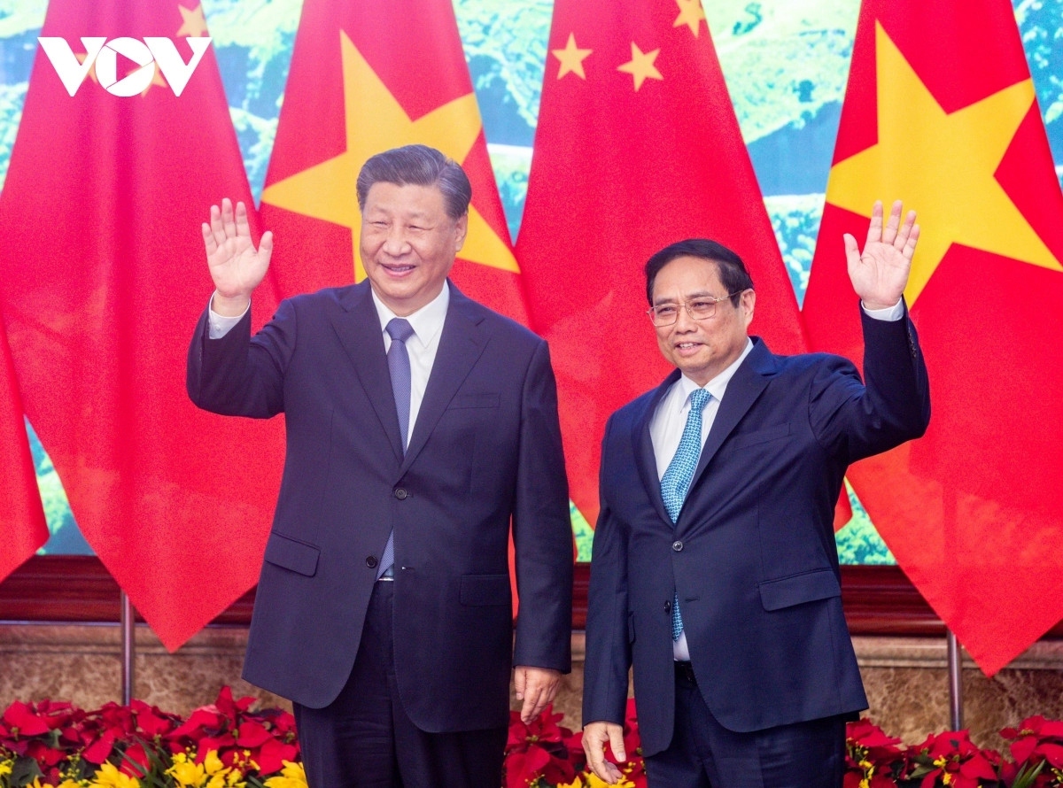 Vietnamese Prime Minister Pham Minh Chinh (R) meets with Chinese Party General Secretary and President Xi Jinping in Hanoi on December 12