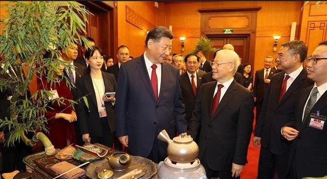 General Secretary of the Communist Party of Vietnam (CPV) Central Committee Nguyen Phu Trong and General Secretary of the Communist Party of China (CPC) Central Committee and President of  China Xi Jinping at the tea party. 
