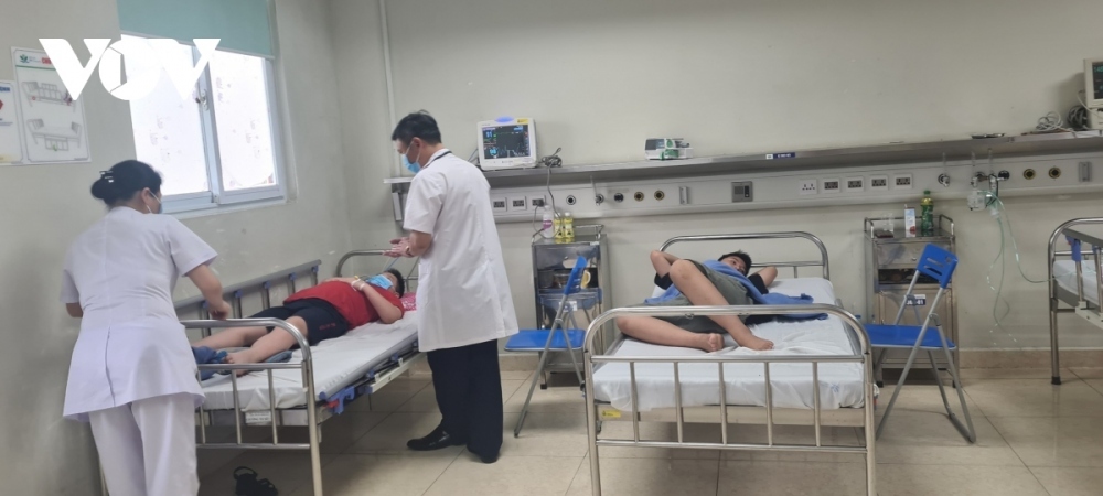 Children with dengue fever receive treatment at a hospital in Hanoi