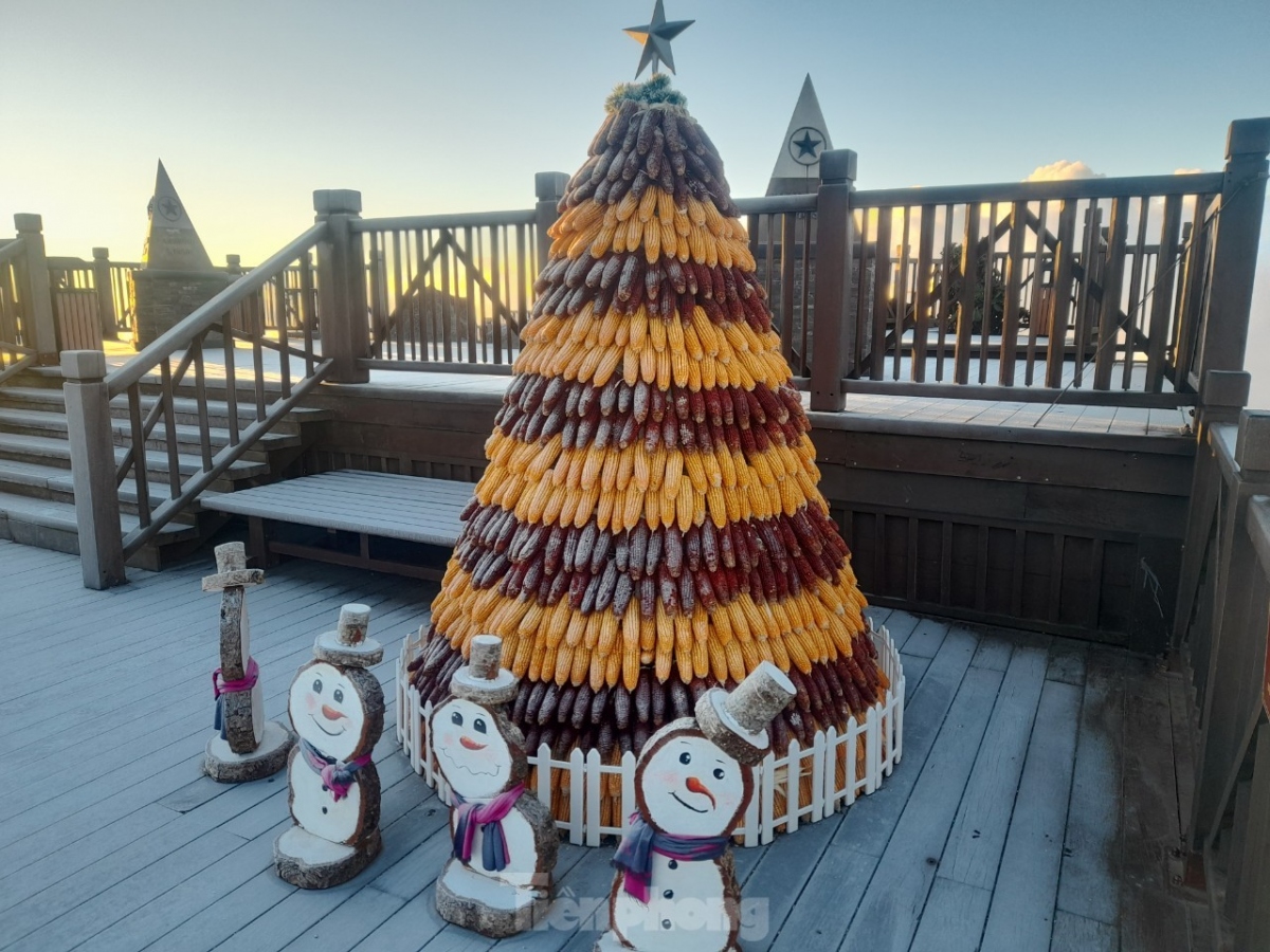 Frost covers snowmen on top the mountain.