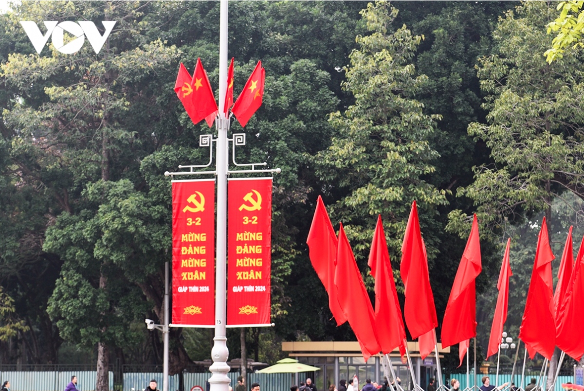 Posters are hung everywhere, with some reading “Happy New Year 2024 – the Year of the Dragon”, “Happy New Spring” or “Celebrating 94 Years of the Communist Party of Vietnam”.