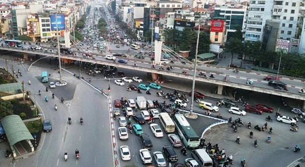 Vehicles cross Nga Tu So (So Intersection) in Hanoi.