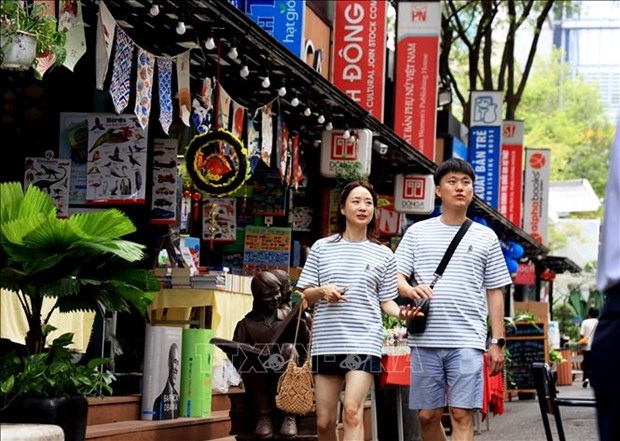 Korean tourists visit book street in Ho Chi Minh City.