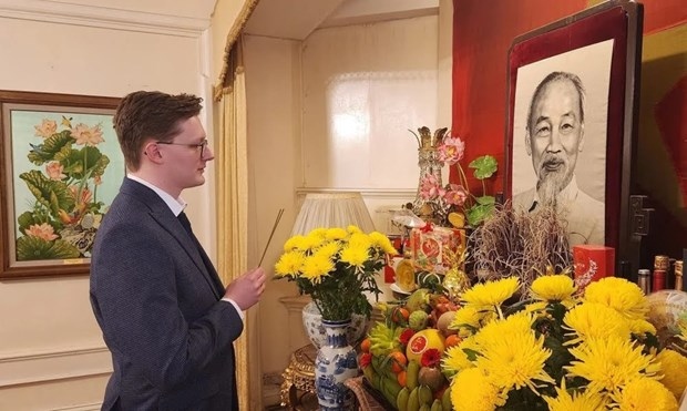British researcher of Vietnamese politics and history Kyril Whittaker pays respect to President Ho Chi Minh at the Vietnamese Embassy in the UK.