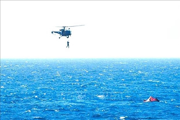 A helicopter rescues crew members on the Barbados-flagged True Confidence cargo ship. (Photo: AFP)