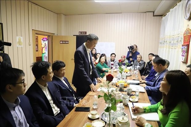 Vietnamese Ambassador to the Czech Republic Duong Hoai Nam (standing) talks to Vietnamese people and businessmen in Moravian-Silesian Region