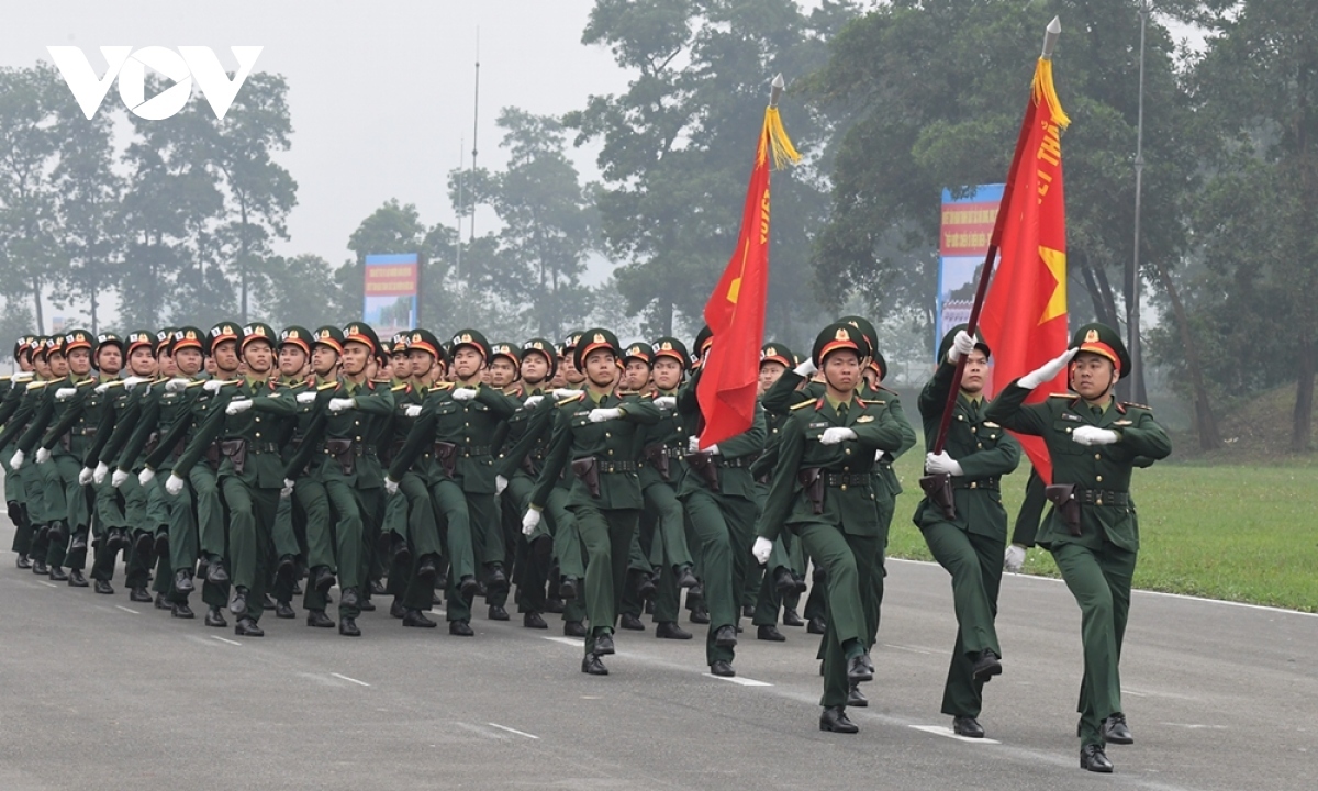 The soldiers enthusiastically rehearse for the parade.