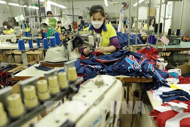 At a garment factory in Hanoi's outlying district of Dan Phuong.