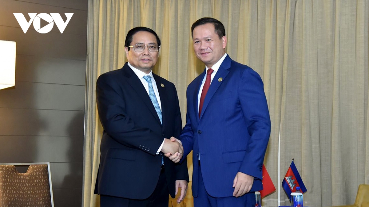 Vietnamese Prime Minister Pham Minh Chinh (L) and his Cambodian counterpart Hun Manet meet in Melbourne, Australia, on March 6