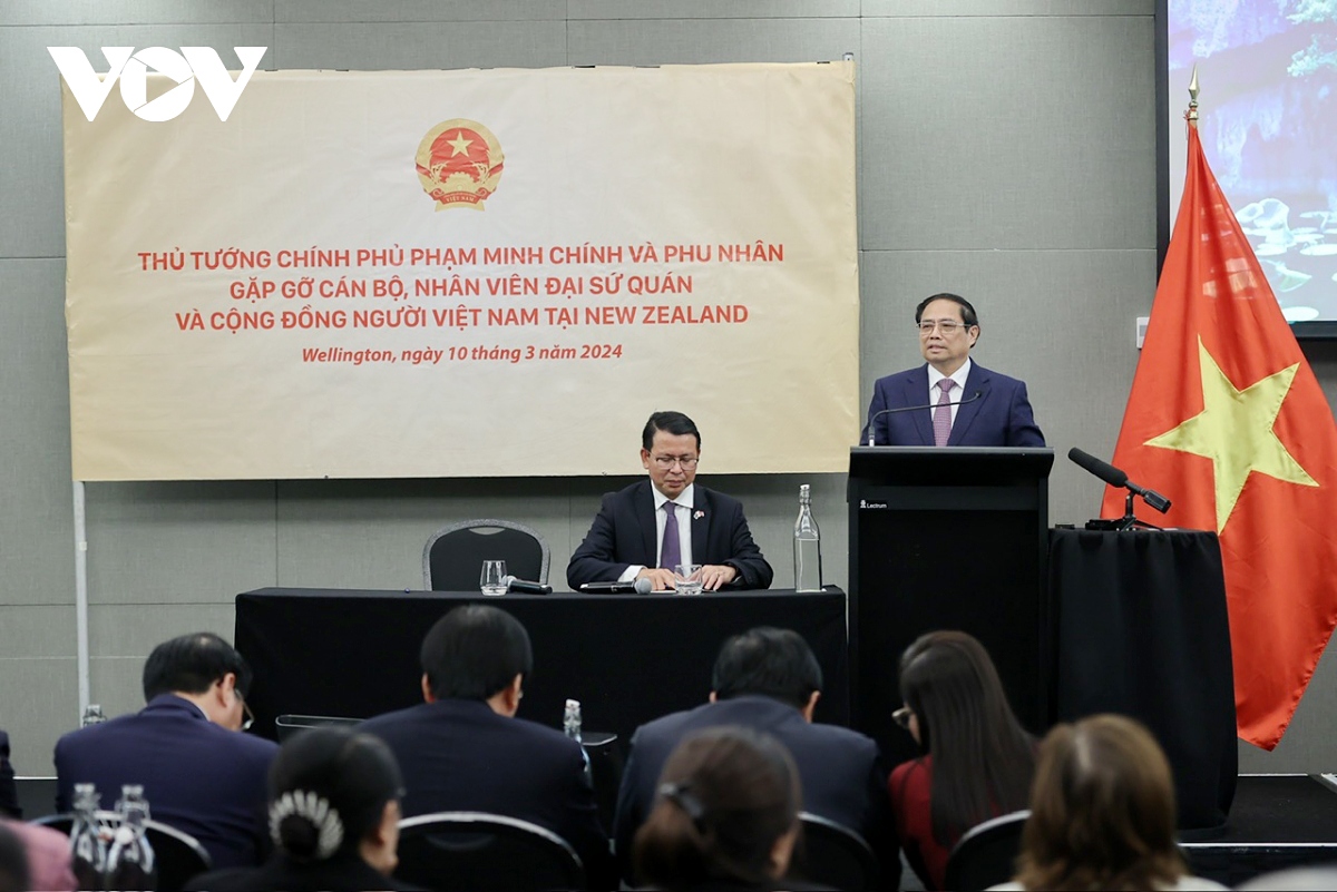 Vietnamese Prime Minister Pham Minh Chinh speaks at his meeting with representatives of Vietnamese expatriates in New Zealand at the Vietnamese Embassy headquarters in Wellington on March 10