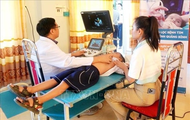 A child is checked by a doctor as part of the programme in Quang Binh's Quang Ninh district.