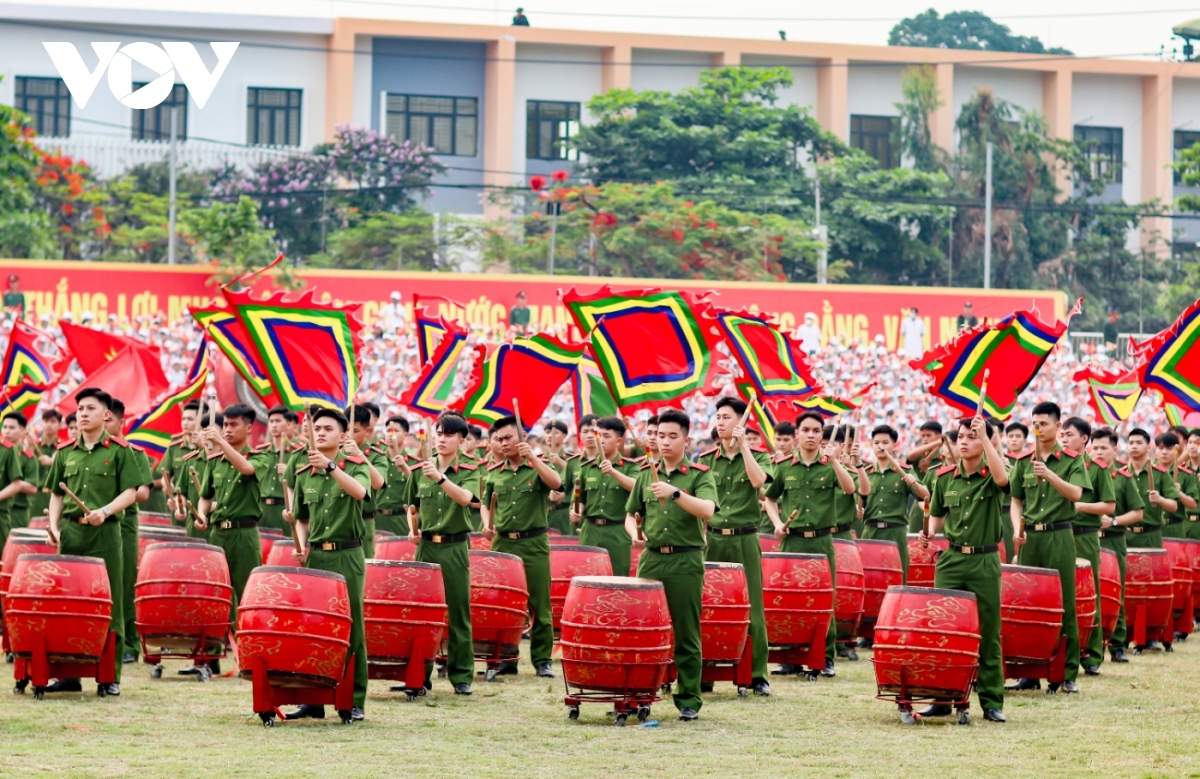 A drum beating performance is held by artists from the Ministry of Public Security ahead of the parade.