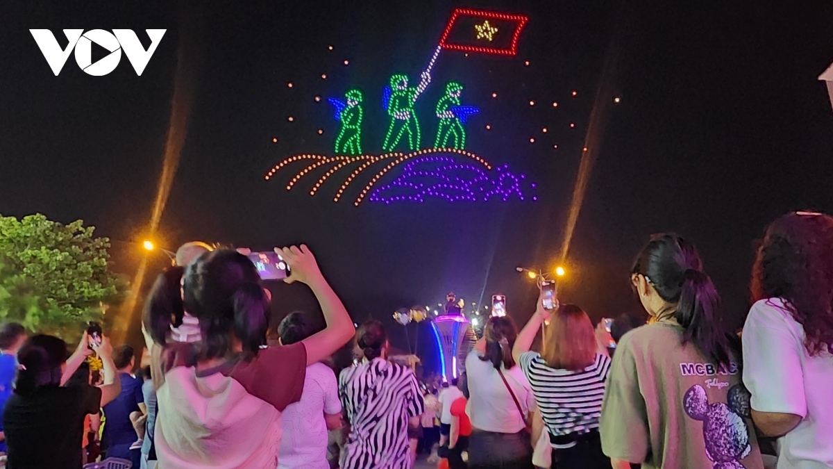 A drone light show features soldiers waving the national flag over the command bunker of French general De Castries.