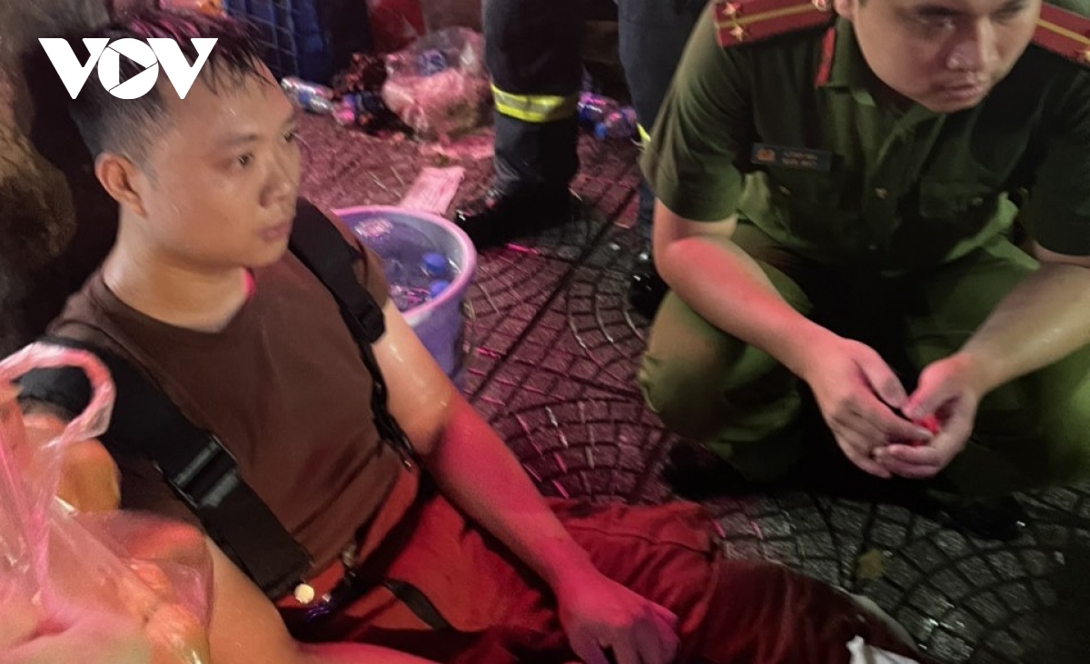 Many firefighters are left exhausted on the rainy evening.