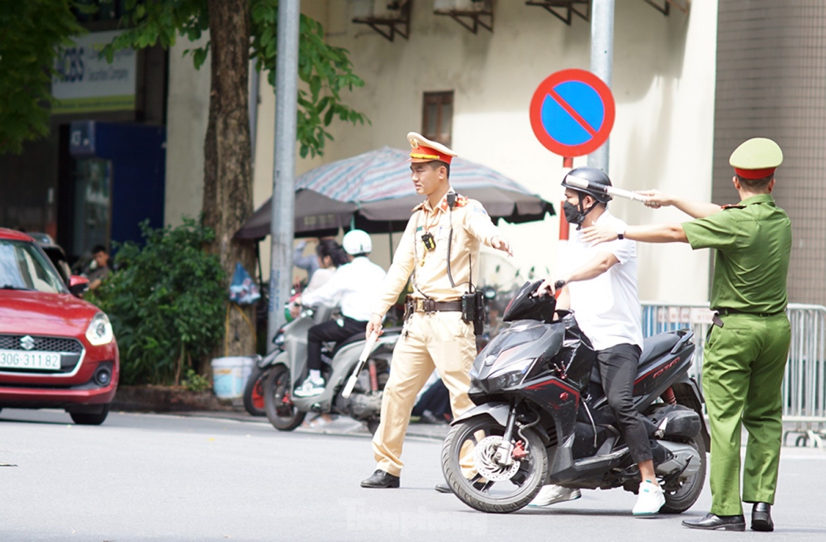 Whilst operating on streets around the capital, traffic officers ease traffic jams to enable the convoy to pass.