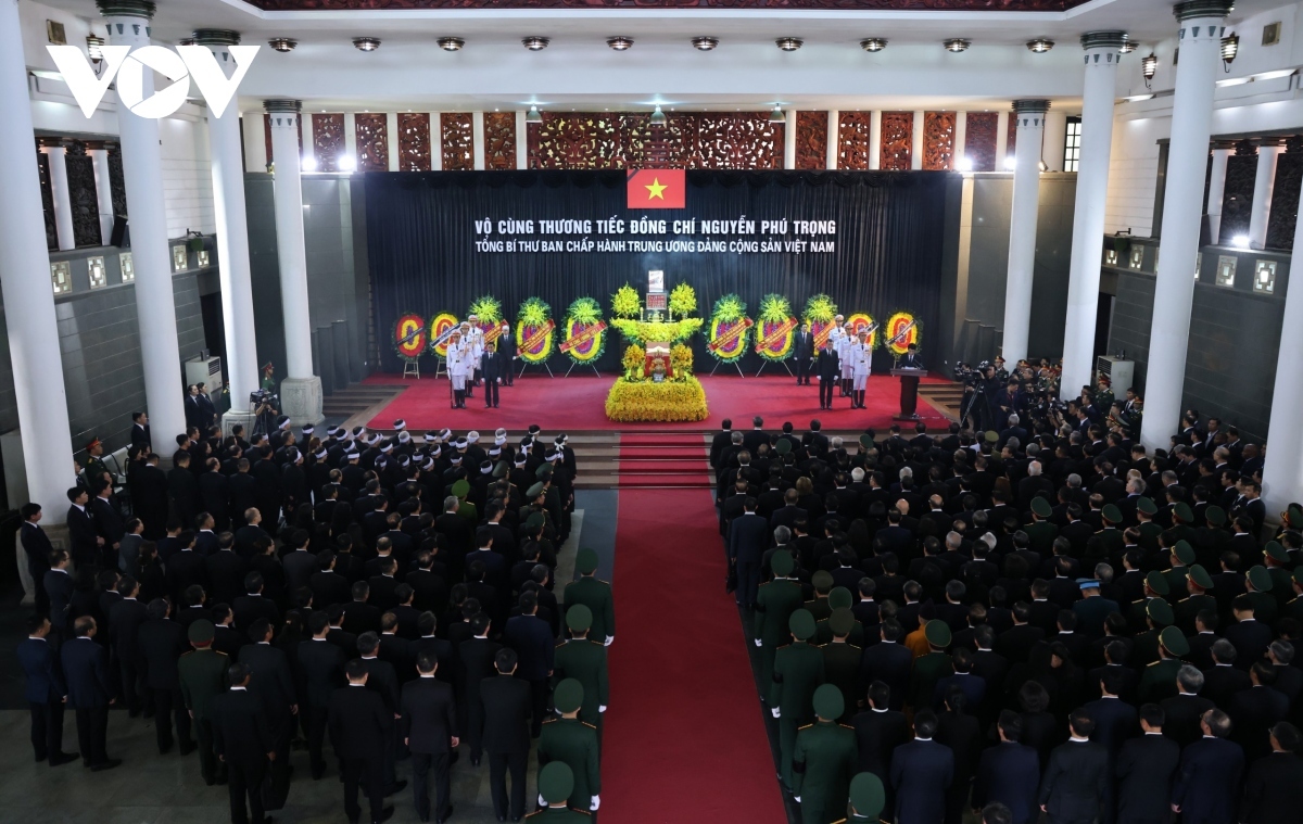 Delegates at the memorial service for the late Party chief 