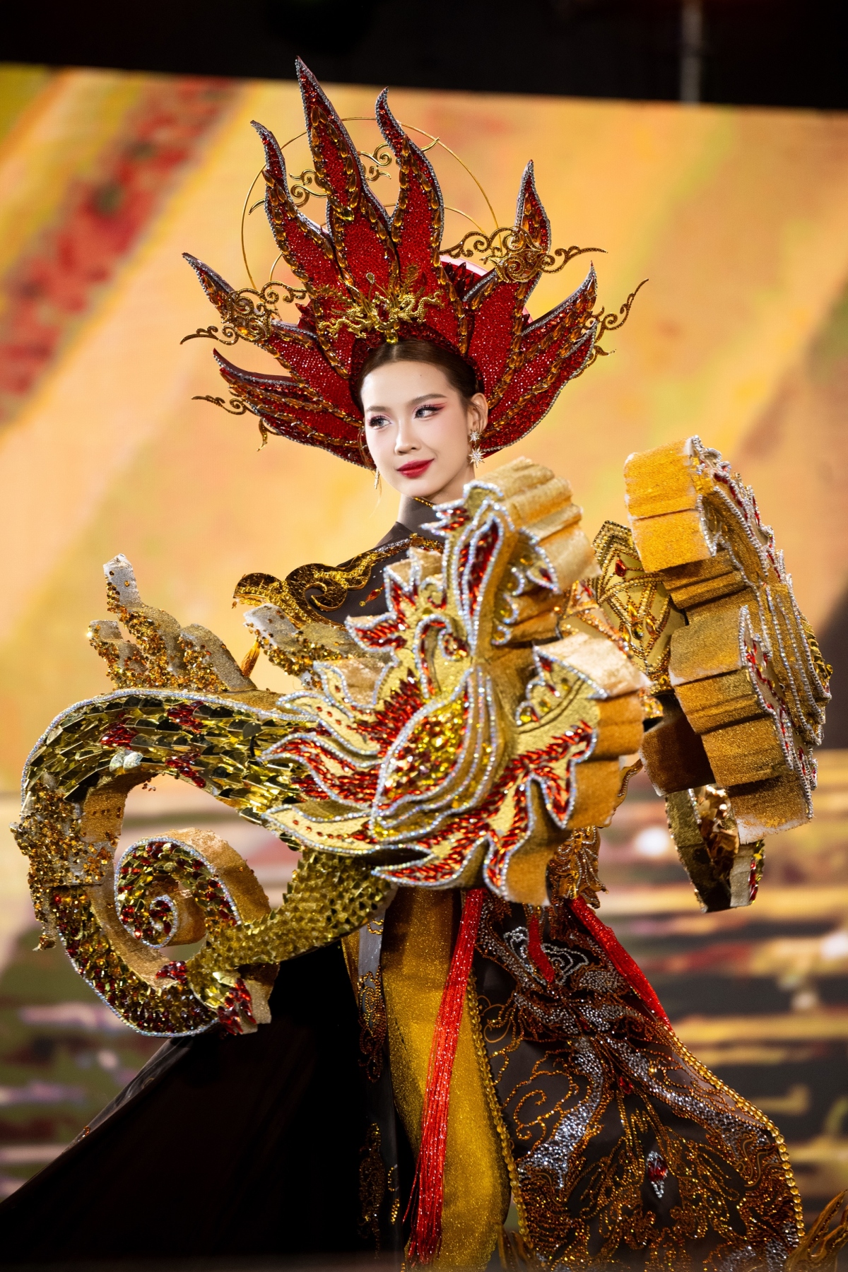 Le Nguyen Bao Ngoc, Miss Intercontinental 2022, models a design by Chau Van Phuc which depicts patterns in Vietnamese religious works.