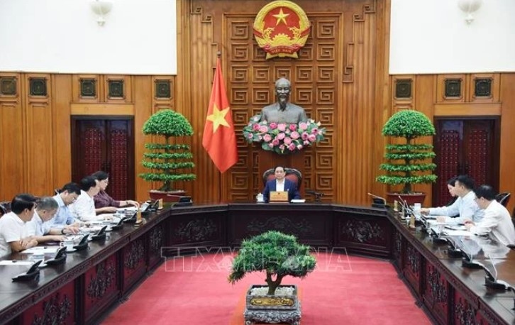 Prime Minister Pham Minh Chinh chairs a meeting on the monetary policy with leaders of the State Bank of Vietnam (SBV), the Ministry of Finance, the Ministry of Planning and Investment, and other ministries and agencies.