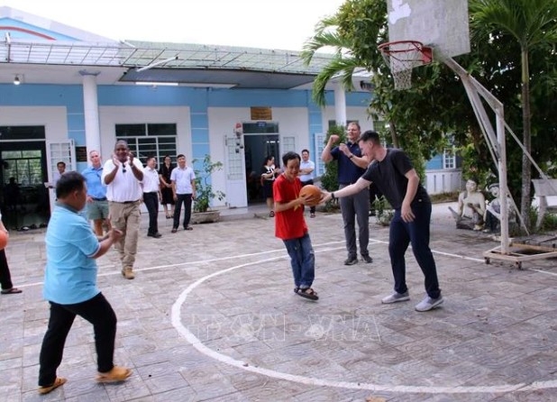 A basketball match with the children cared at the centre takes place as part of the visit.