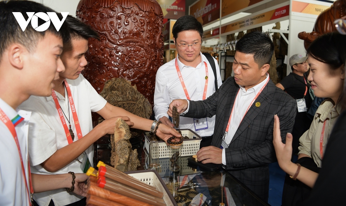 Visitors explore the process of making Vietnamese handicraft items.