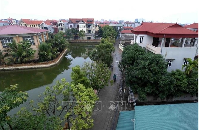 A rural road in Song Phuong commune, Dan Phuong district. All the 382 communes and 18 districts in capital city of Hanoi have satisfied new rural standards