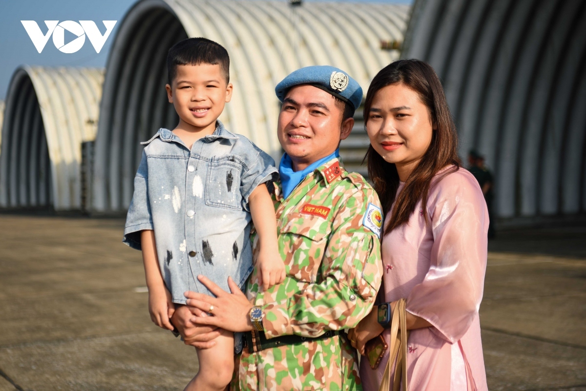 A family says goodbye to each other before going on the international mission.