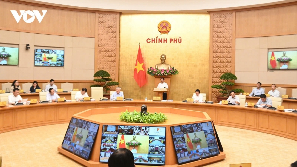 Prime Minister Pham Minh Chinh chairs a Government meeting reviewing national socio-economic performance in September and the past nine months of the year, in Hanoi on October 7.