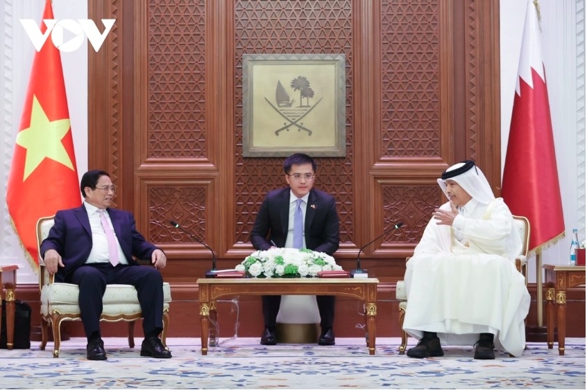 Vietnamese Prime Minister Pham Minh Chinh (L) meets with Speaker of the Shura Council (Consultative Assembly) of Qatar Hassan bin Abdulla Al-Ghanim 