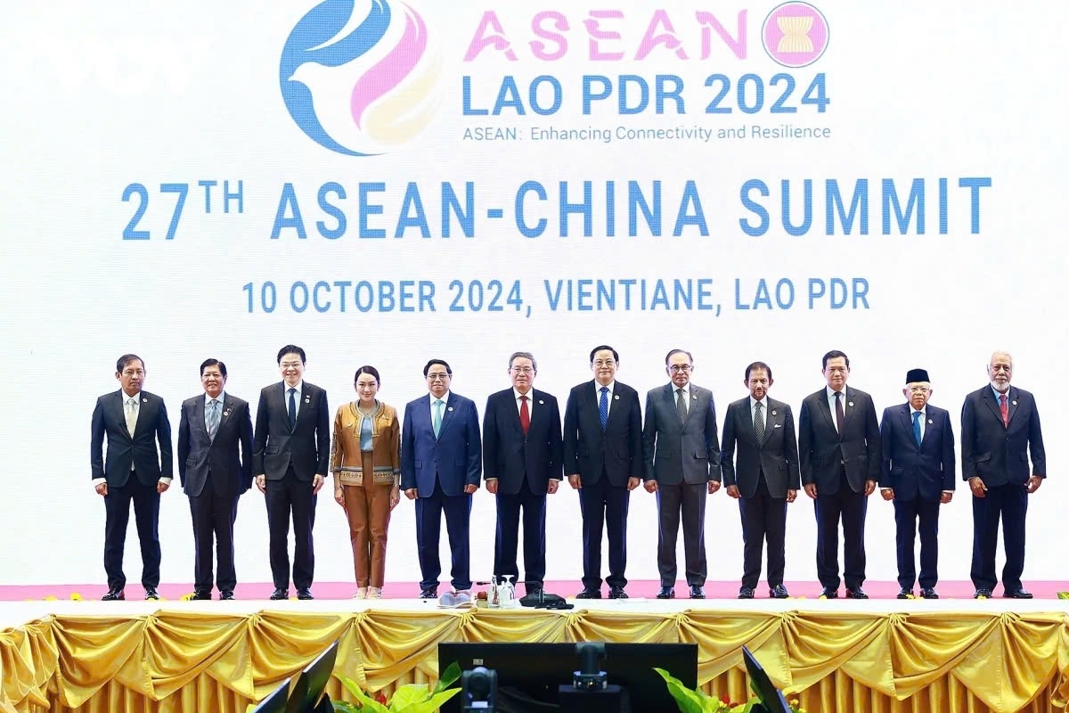 The leaders of ASEAN and China pose for a group photo at the 27th ASEAN-China summit in Vientiane, Laos, on October 10