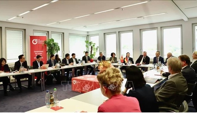 At the working session between Deputy Prime Minister Ho Duc Phoc and the BVMW International delegation on October 9. (Photo: VNA)