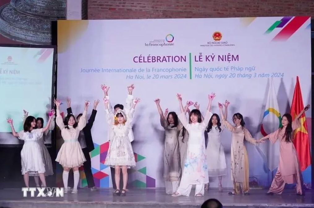 Students learning French present a cultural performance during the celebration of International Francophonie Day in Hanoi on March 20, 2024.