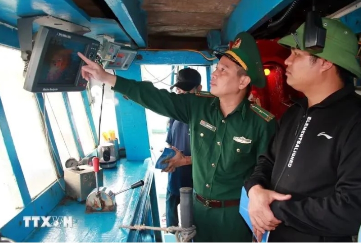 A representative from authority inspects the installation of vessel monitoring system (VMS) in a fishing vessel.