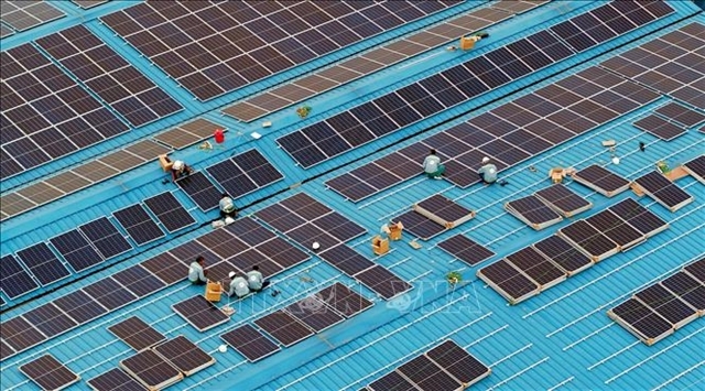 Solar panels are installed on the roof at the Duong River Surface Water Plant. (VNA/VNS Photo)