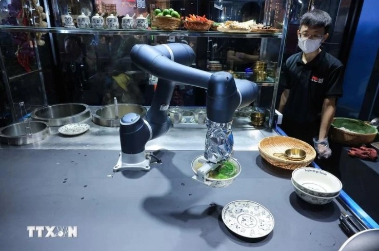Pho (rice noodle soup) is prepared by smart robots.
