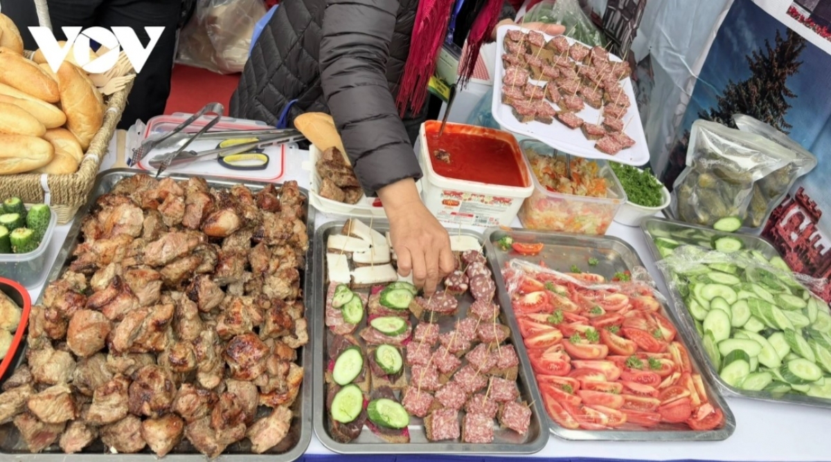 The Belarus booth draws festival goers.