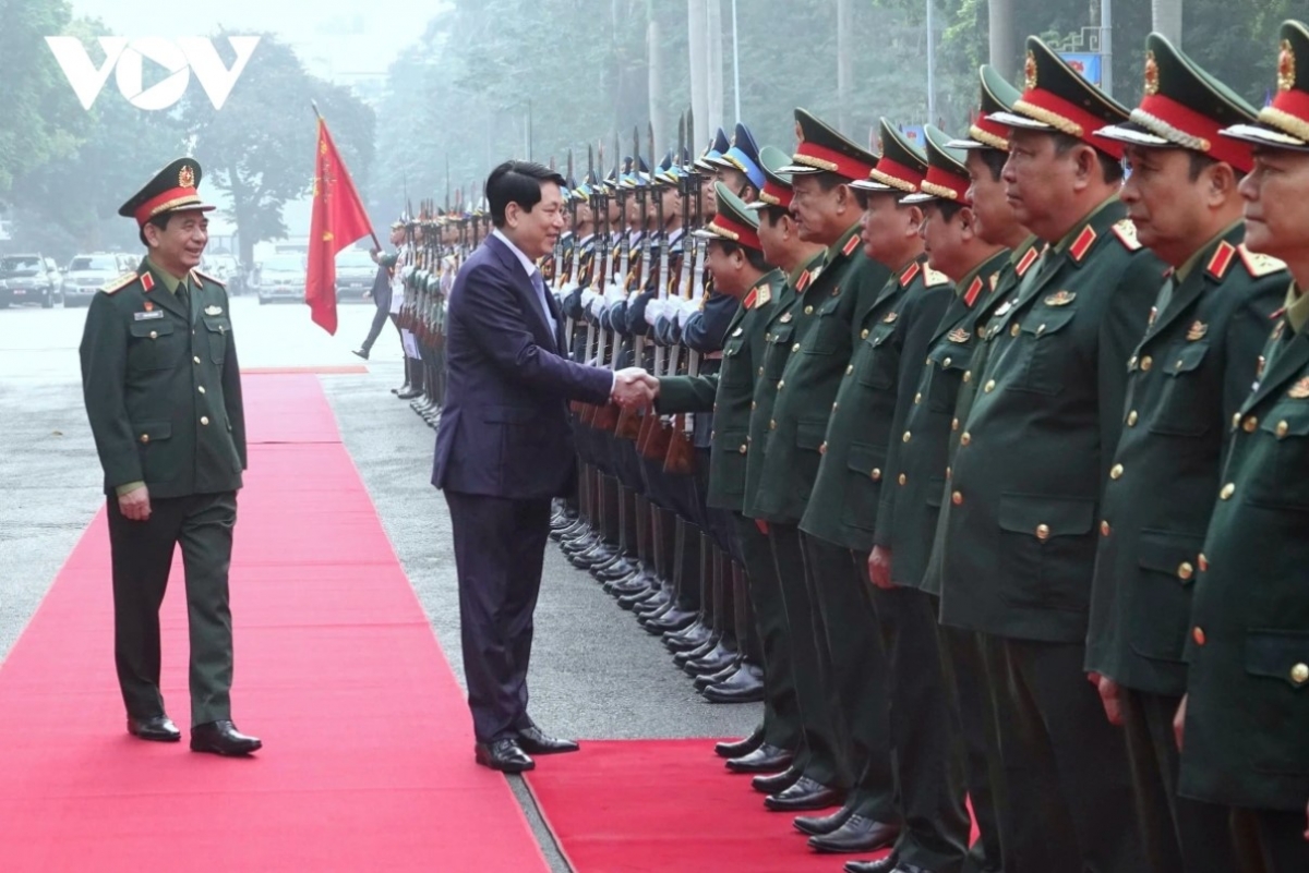 President Luong Cuong greets leaders of the Ministry of National Defence.