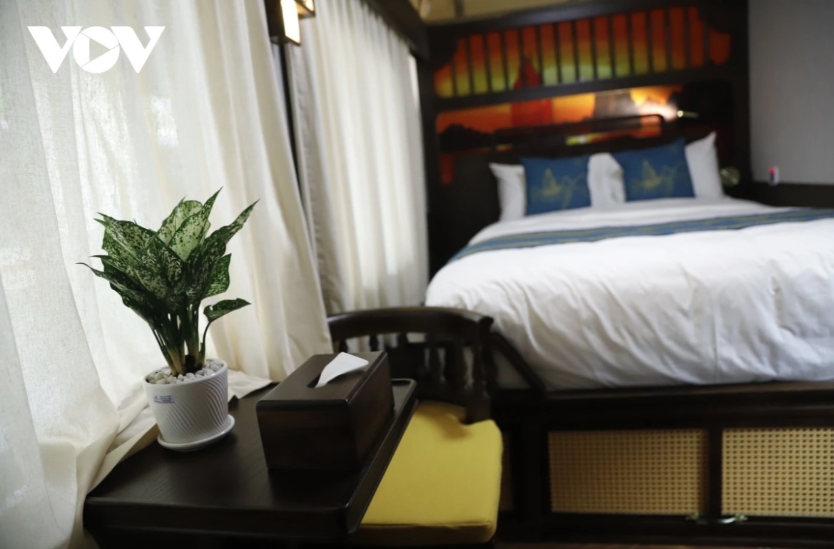 In addition to the bed, each room is also furnished with a seating area by the window, providing enough space for two adults to sit comfortably.