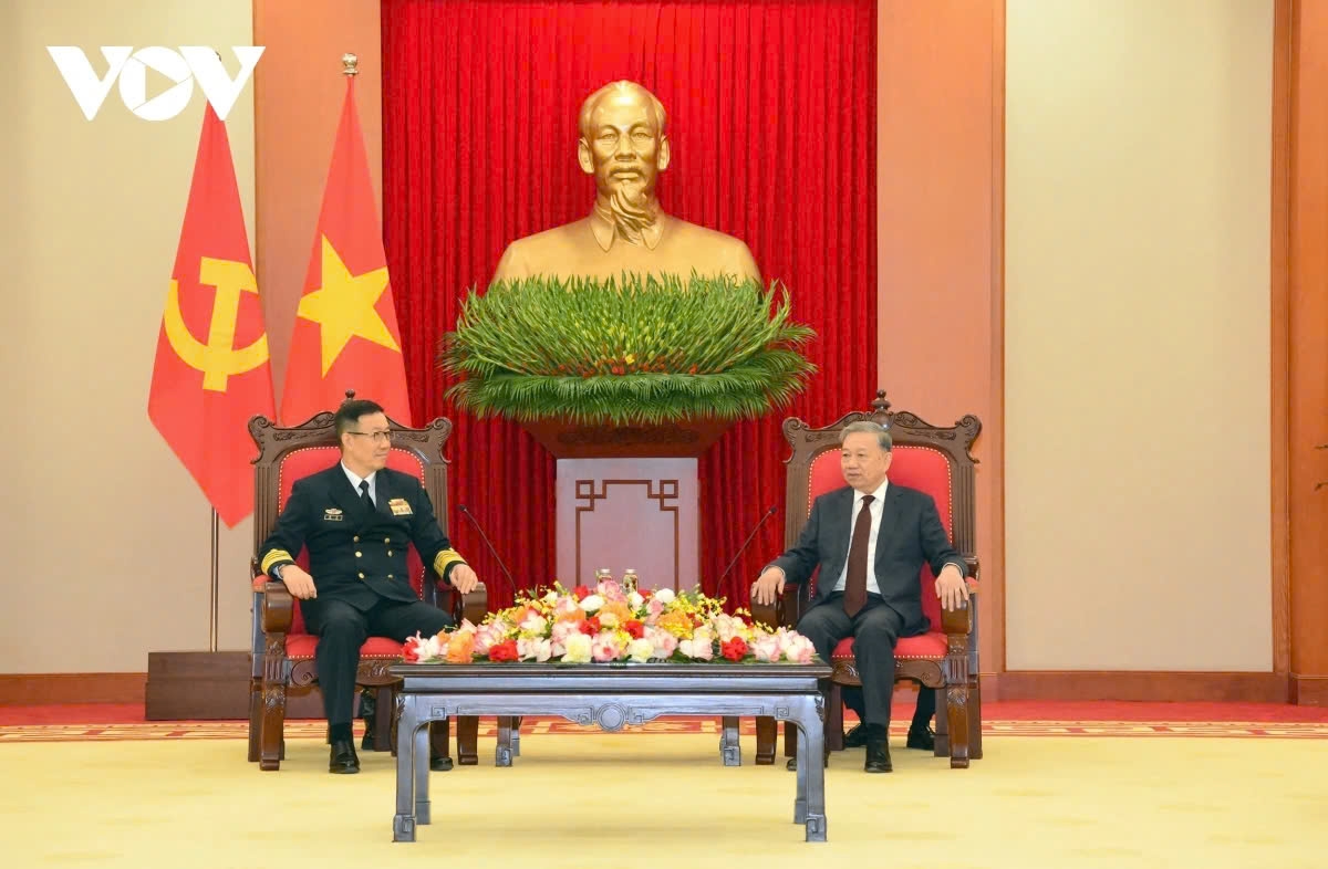 Party General Secretary To Lam (R) and Chinese Defense Minister Admiral Dong Jun during their meeting in Hanoi on December 19