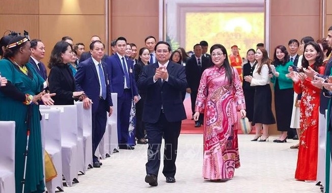 PM Pham Minh Chinh and his spouse at the banquet. (Photo: VNA)